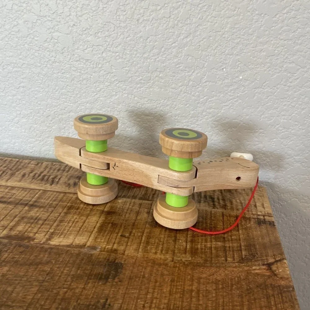 Hape Wooden Walk Along Pull Toy Snail Worm Wobbly Eyes Wheels Kids